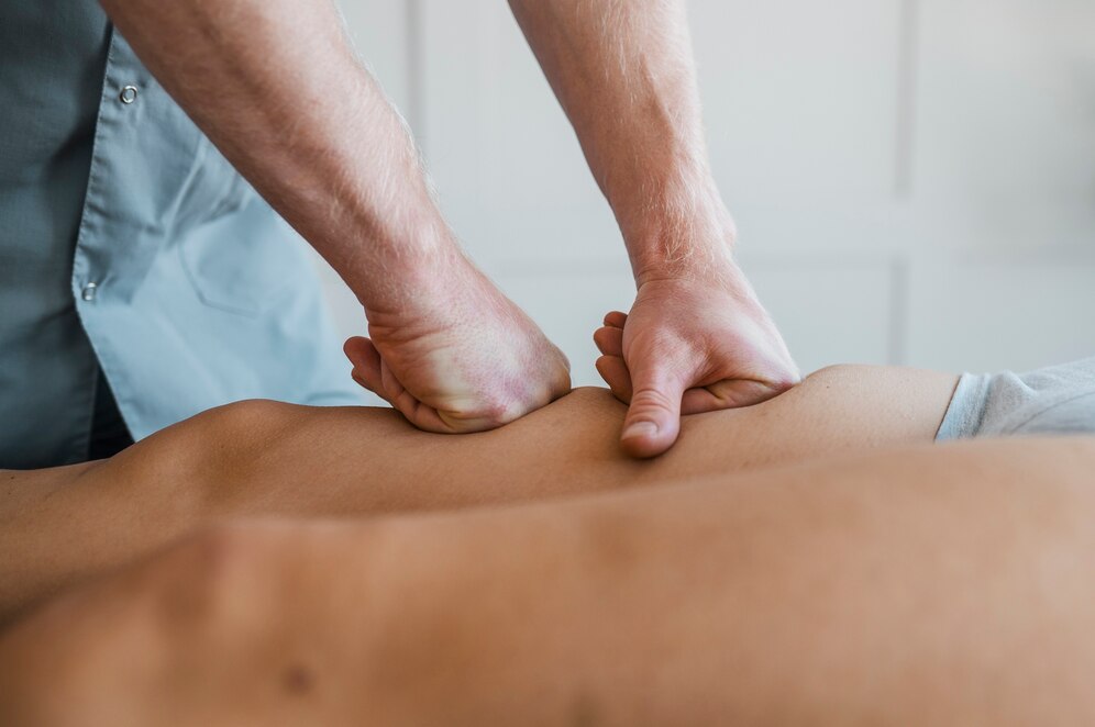 male-physiotherapist-massage-session-with-female-patient_23-2148789783